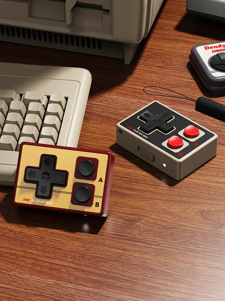 Two IINE GameBrick Mini controllers in a desk setup