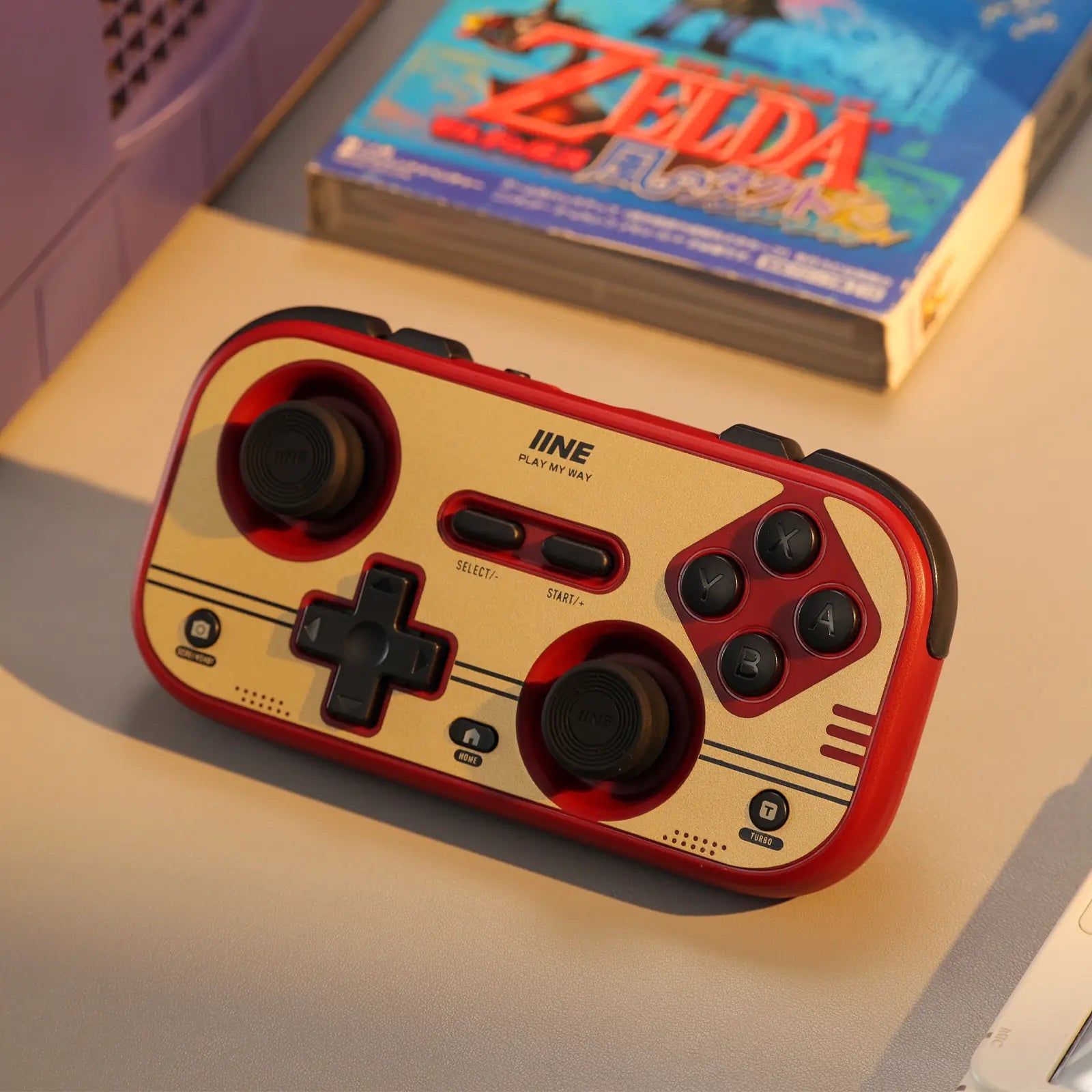 Gold IINE Retro Chronos controller in a warm gaming setup
